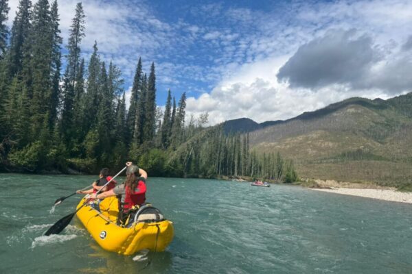 Randi and Marshall paddle in a yellow inflatable canoe, photo by Ronalda Moses. Randi and Marshall paddle in a yellow inflatable canoe, photo by Ronalda Moses.