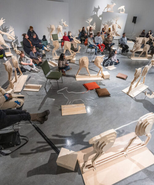 Attendees sat within a herd of 30 life-sized caribou sculptures.